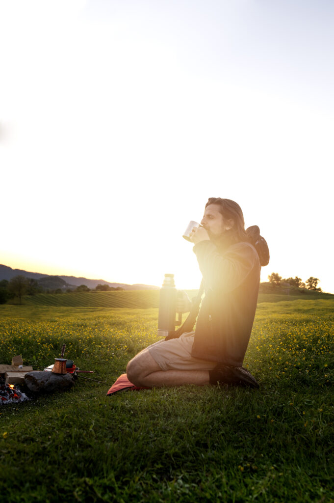 side view man drinking coffee outdoors